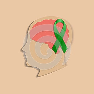 The concept of World Mental Health Day. Green awareness ribbon and brain symbol.